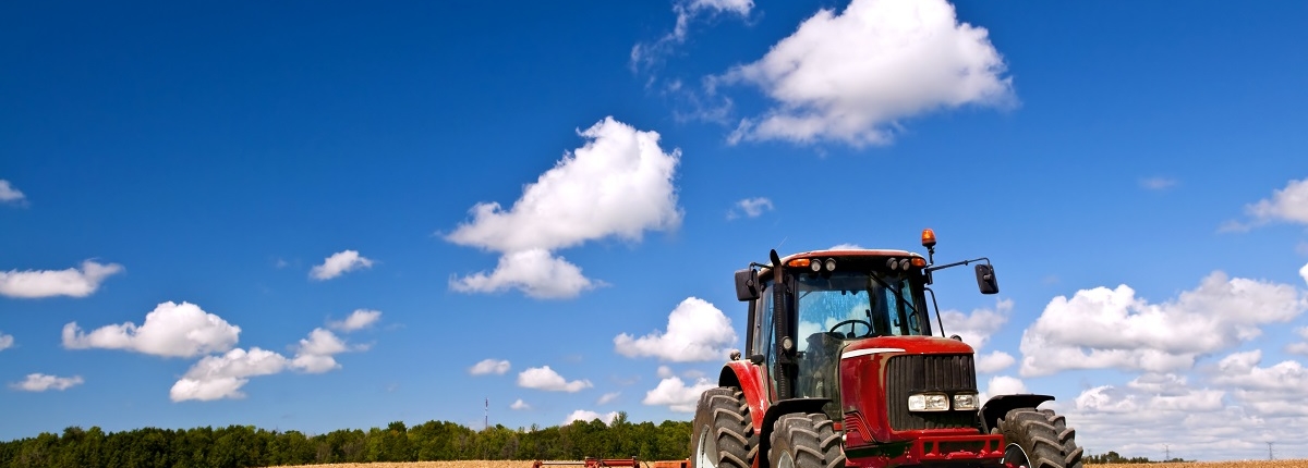 Tractor in plowed field