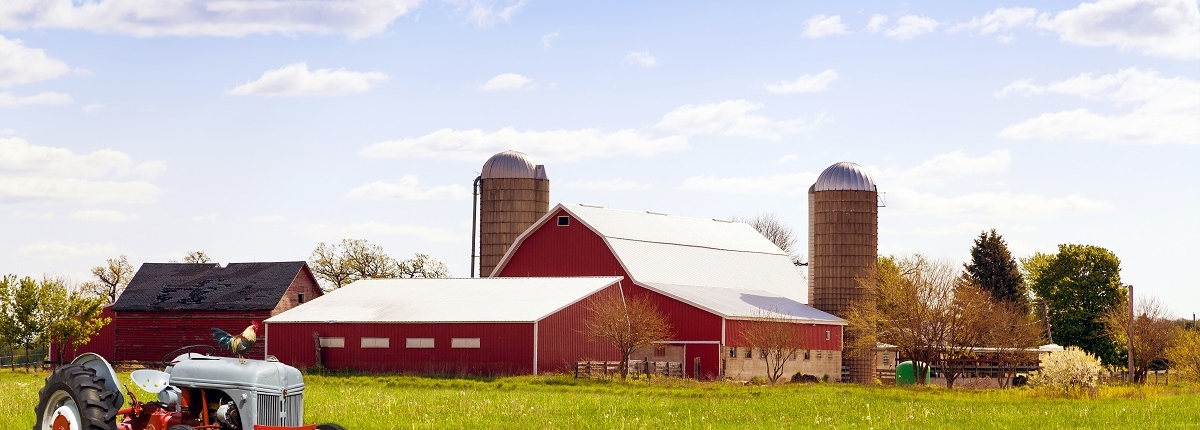 Traditional american red farm with tractor